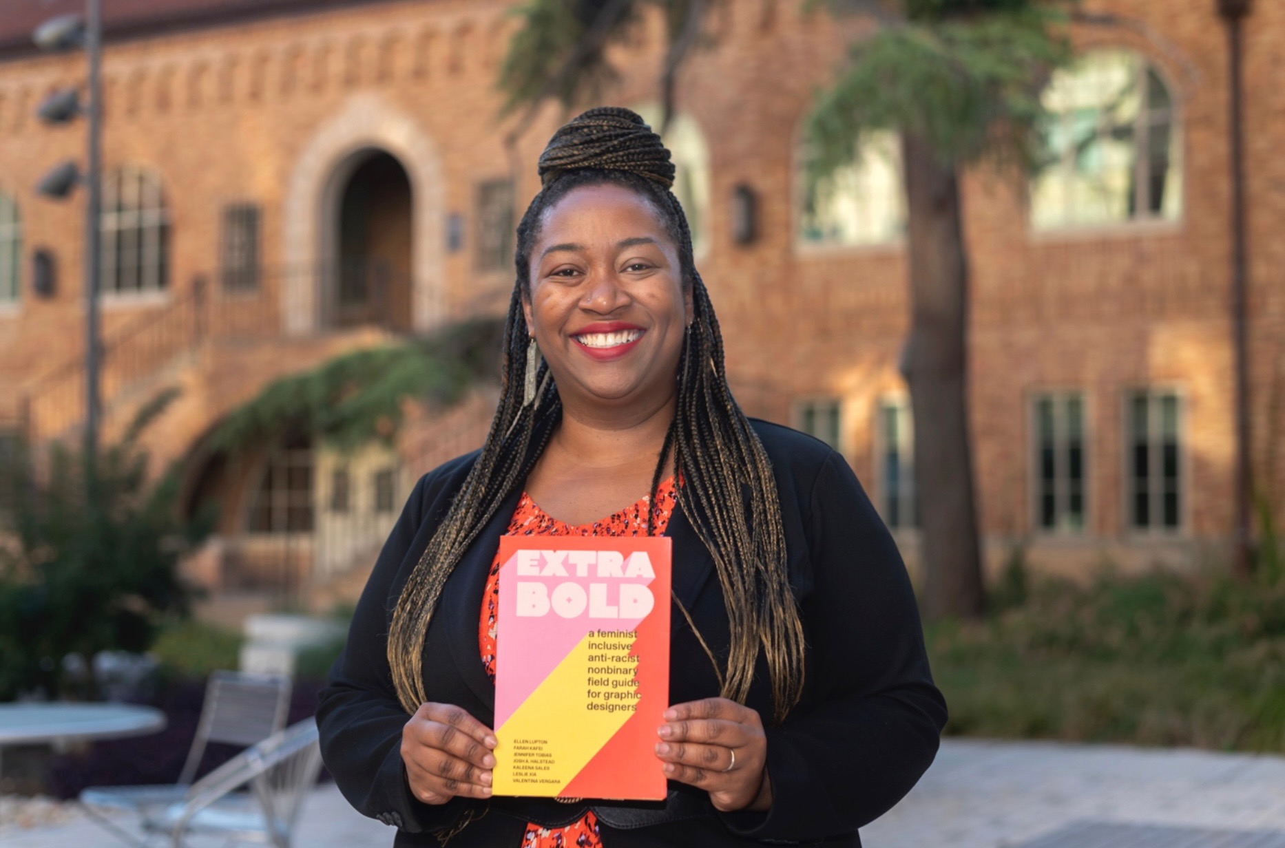 Kaleena Sales with her book, "Extra Bold"