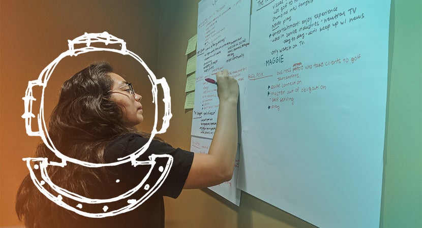 woman writing on white board