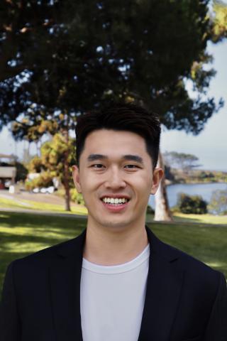Headshot of Laurent Wang outside