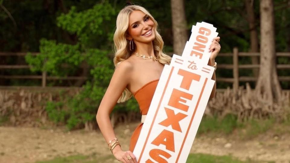 Cropped image of Alexis Fuetsch holding Texas sign