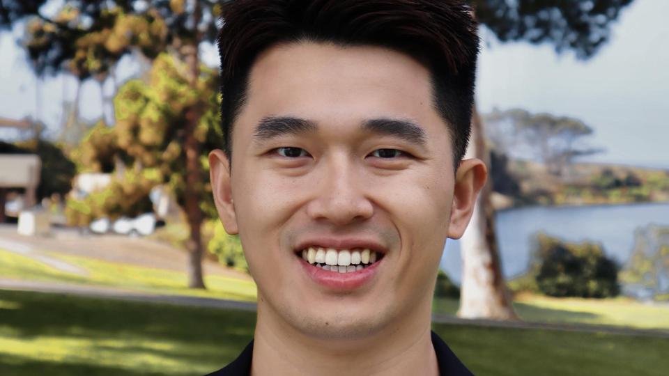 Headshot of Laurent Wang outside