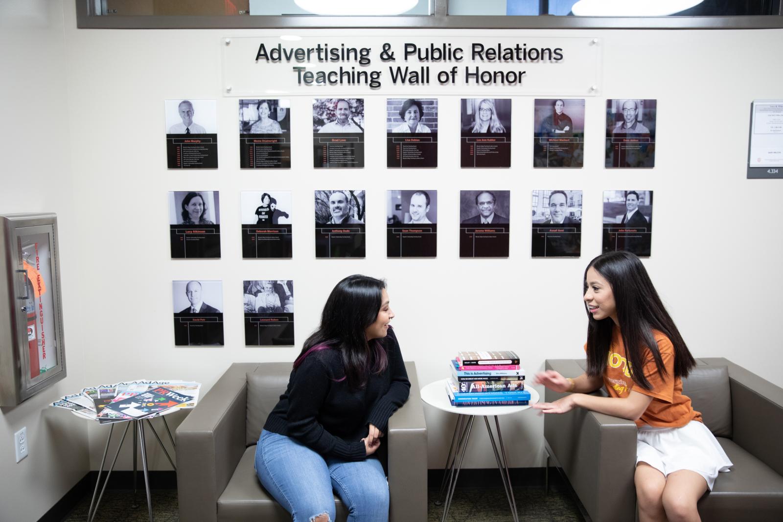 Two students sitting and chatting