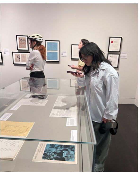 student taking photograph of display at HRC