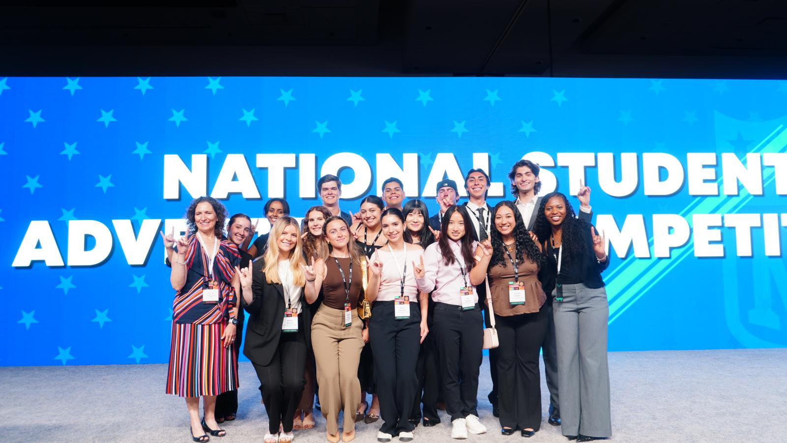 group of NSAC students and Liza Lewis on stage