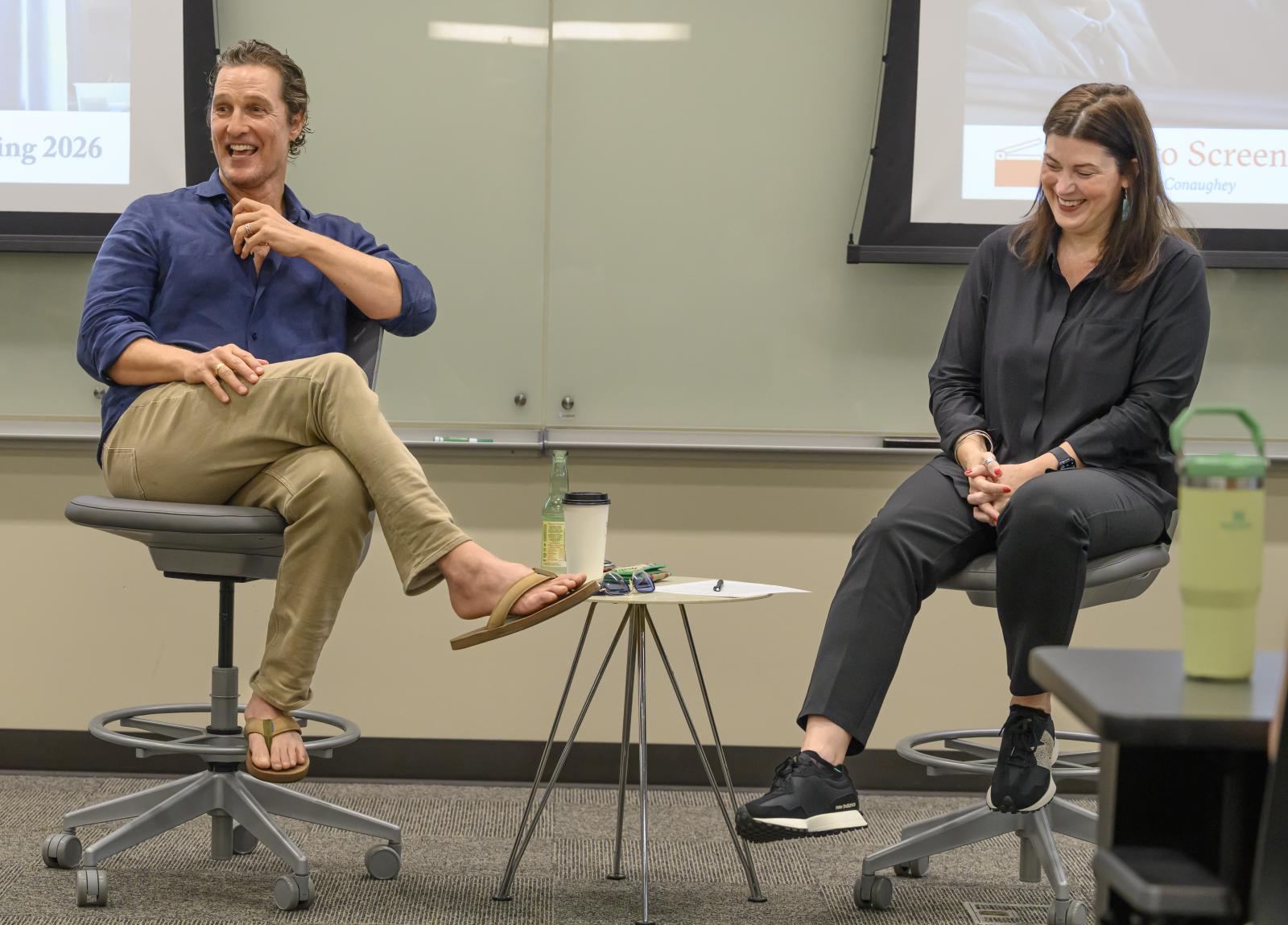 Matthew McConaughey sits with Laura Bright, both laugh