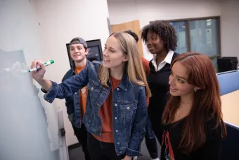 students at a whiteboard